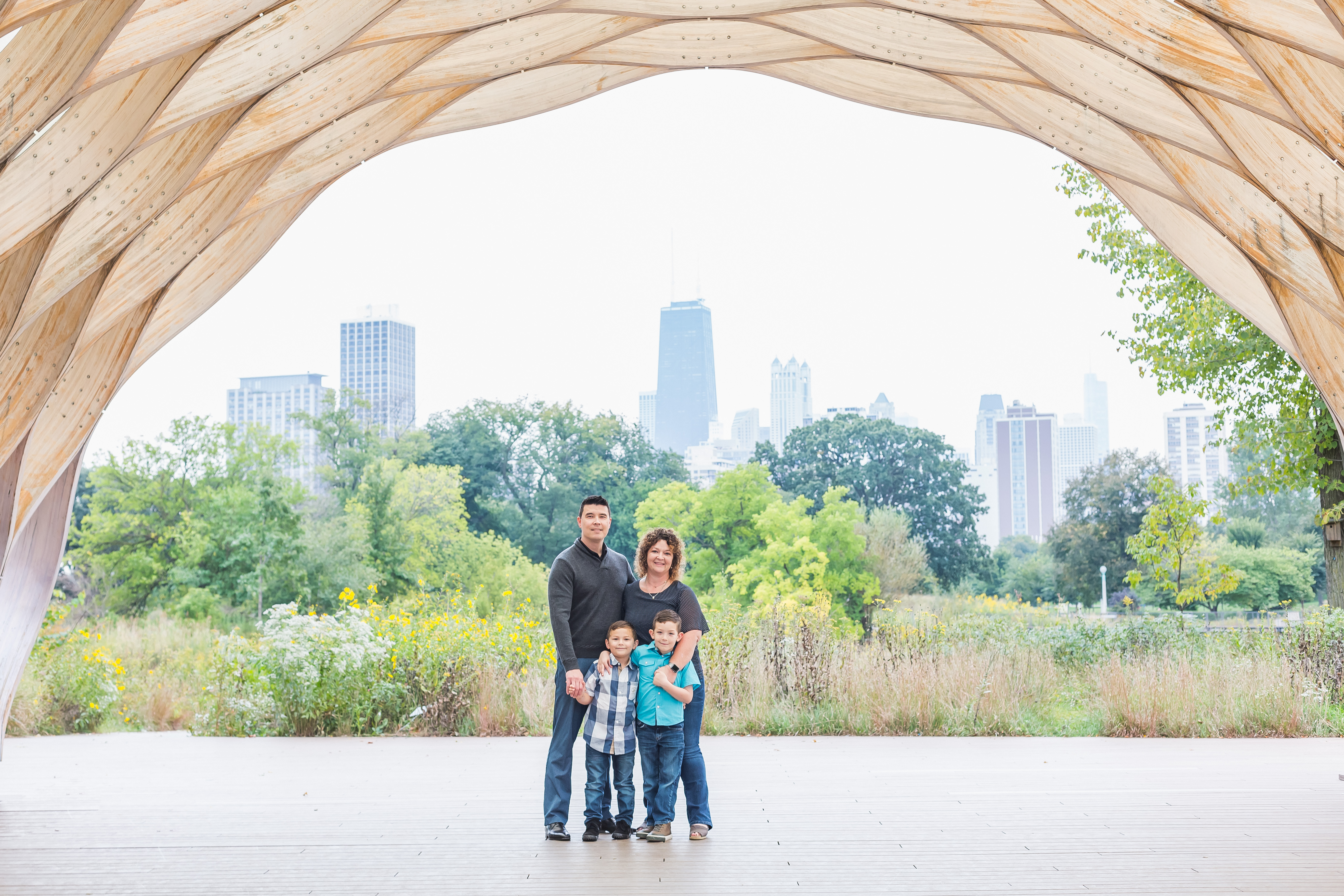 Family of 4 portraits with Chicago skyline in background
