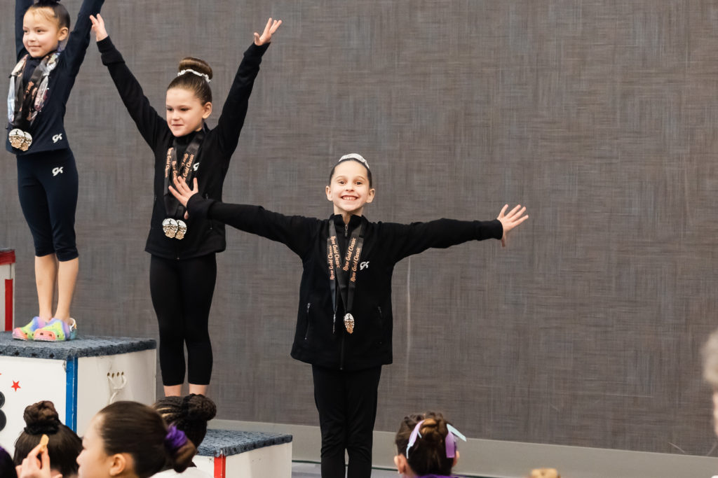 Blog: Young gymnast receiving her medals