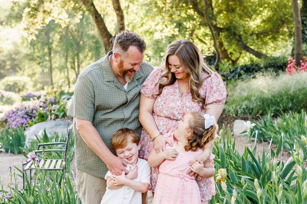 Portraits matter - Family of 4 ejoying their time together during their portrait session.