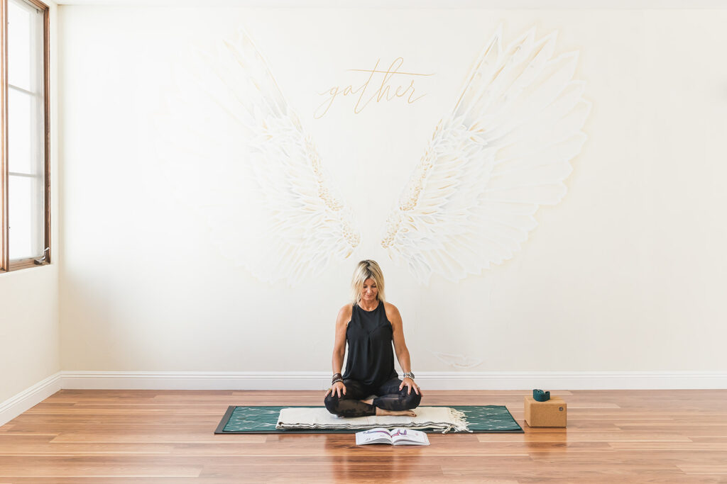 Brand photography with Gather La Quinta in La Quinta CA. Client preparing to teach yoga