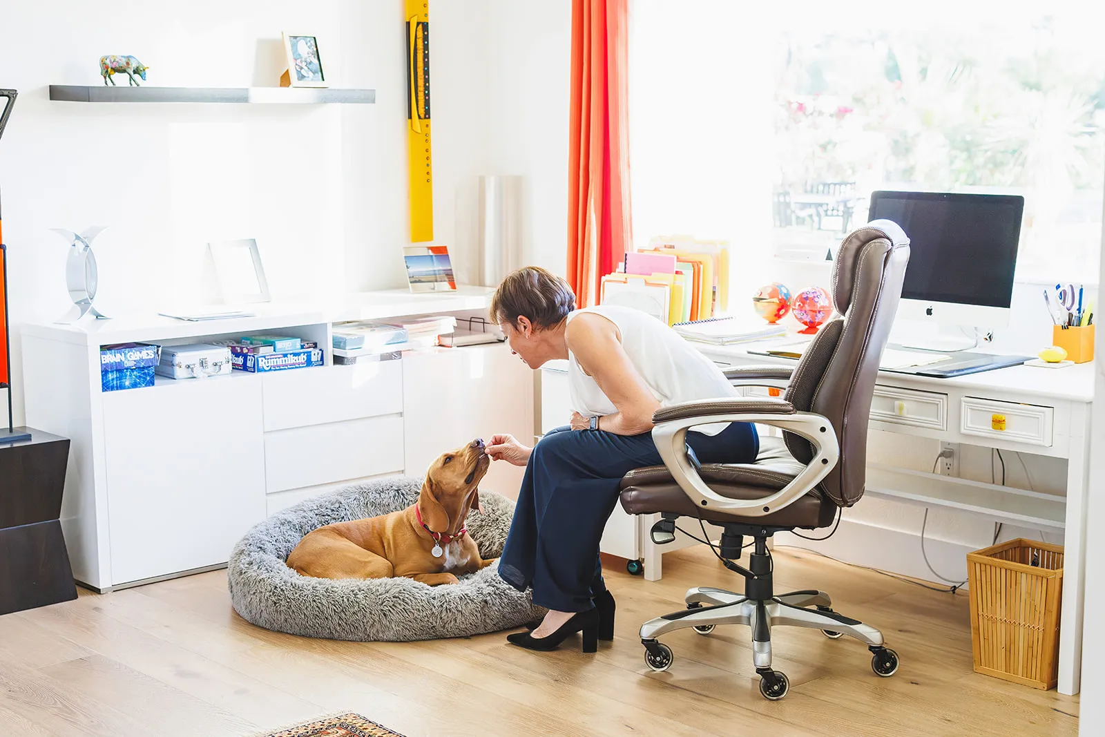 Brand photography session with Anne Stark with Berkshire Hathaway Home Services in Indian Wells CA. Anne is in her home office with her dog Cookie in La Quinta CA
