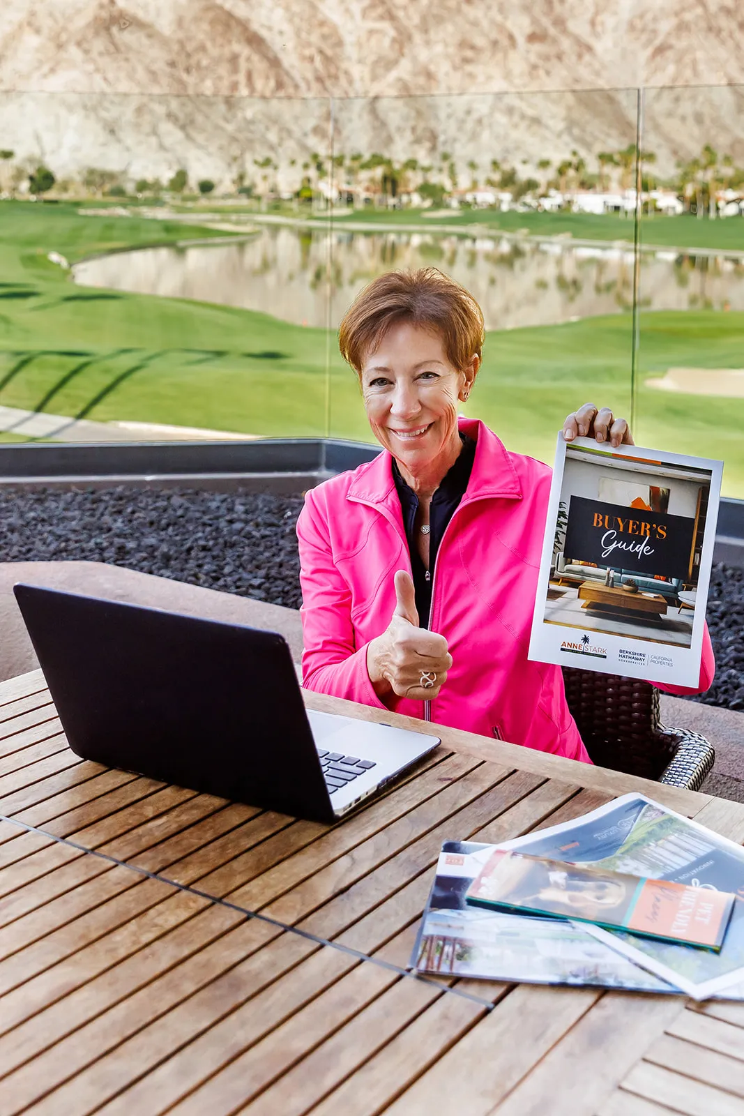 Brand photography session with Anne Stark with Berkshire Hathaway Home Services in Indian Wells CA. Anne is on a golf course working and showing her flyer in La Quinta CA