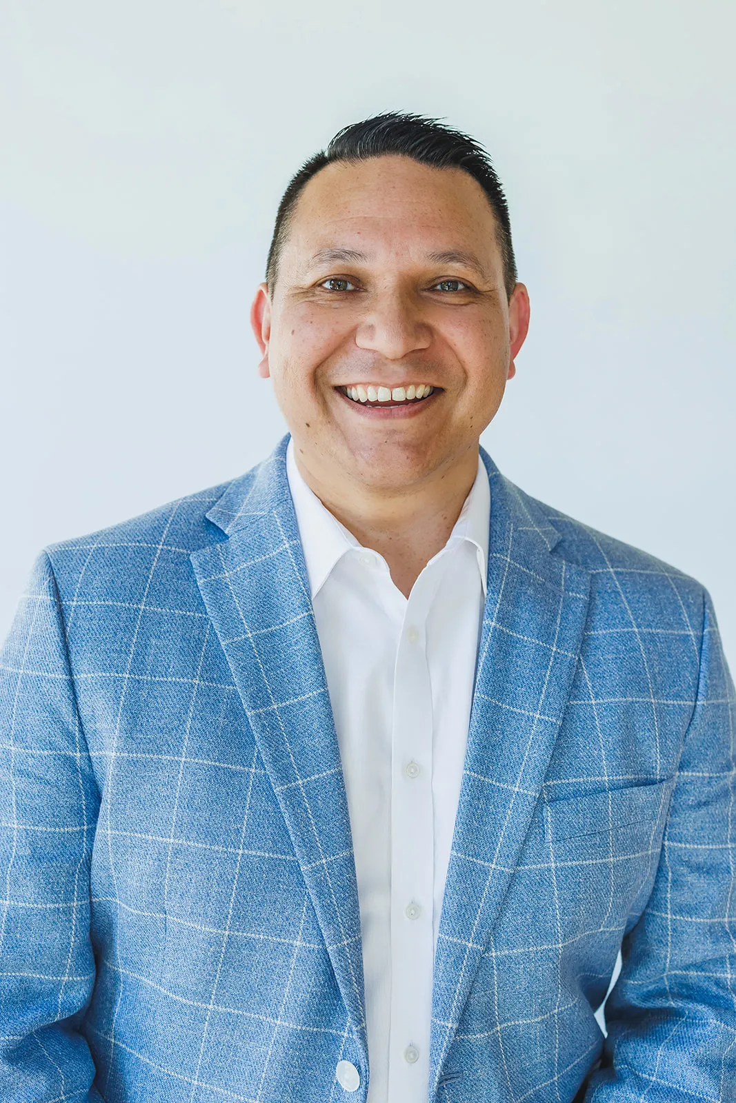 Walking headshot of man in blue suit by Ann Keen Photography in Folsom, CA