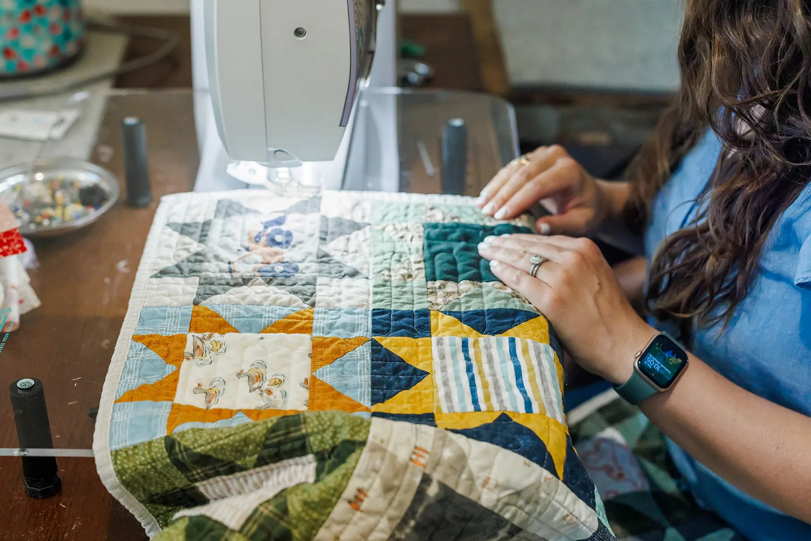 Up close photo of a tractor quilt being made from brand session in Auburn CA with Leal's Coop