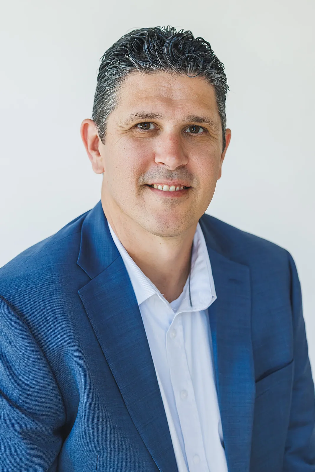 Walking headshot of man in blue suit by Ann Keen Photography in Folsom, CA