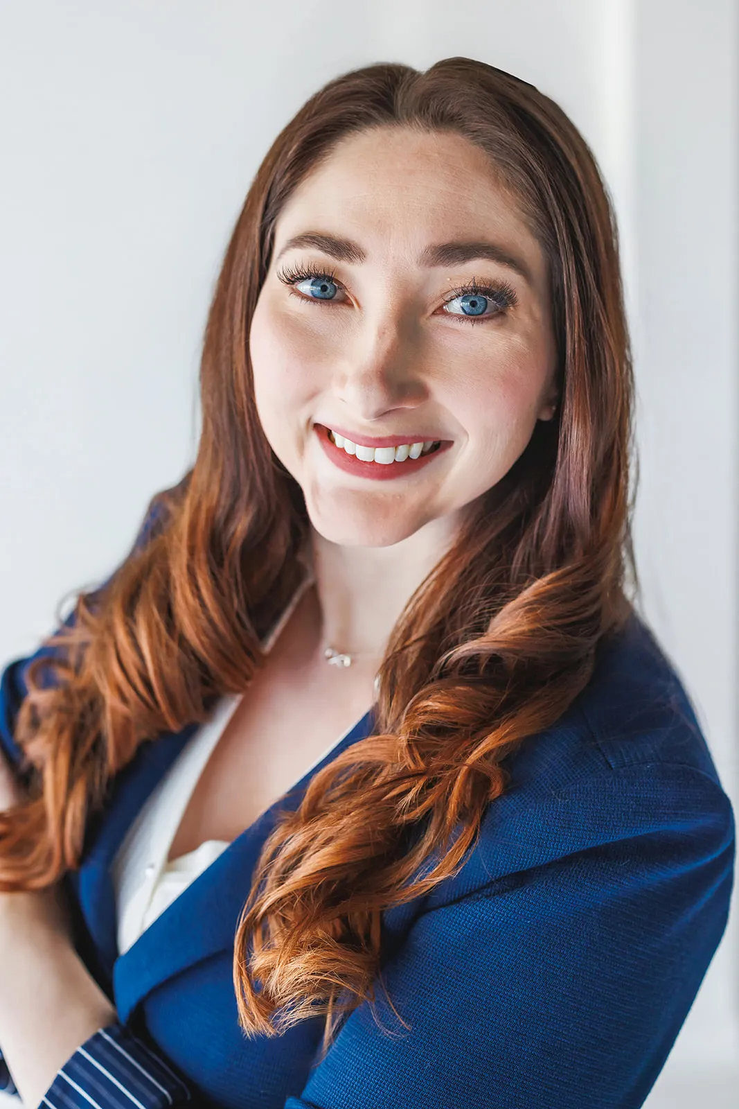 Headshot of woman in blue blazer by Ann Keen Photography in Roseville, CA