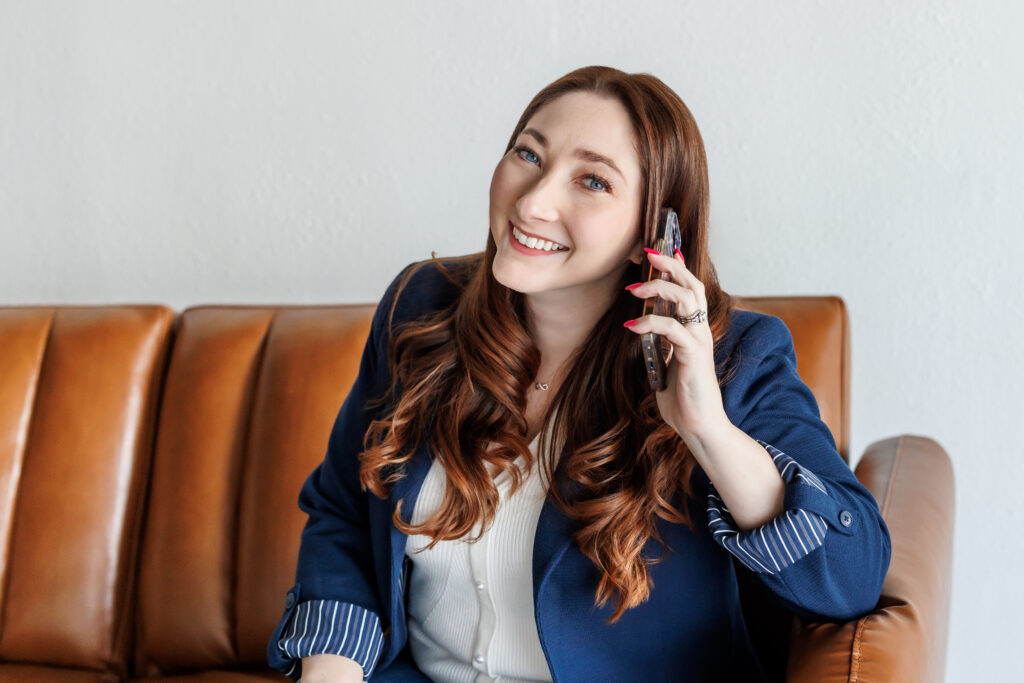 Brand Photography of woman in blue blazer on the phone by Ann Keen Photography in Roseville, CA