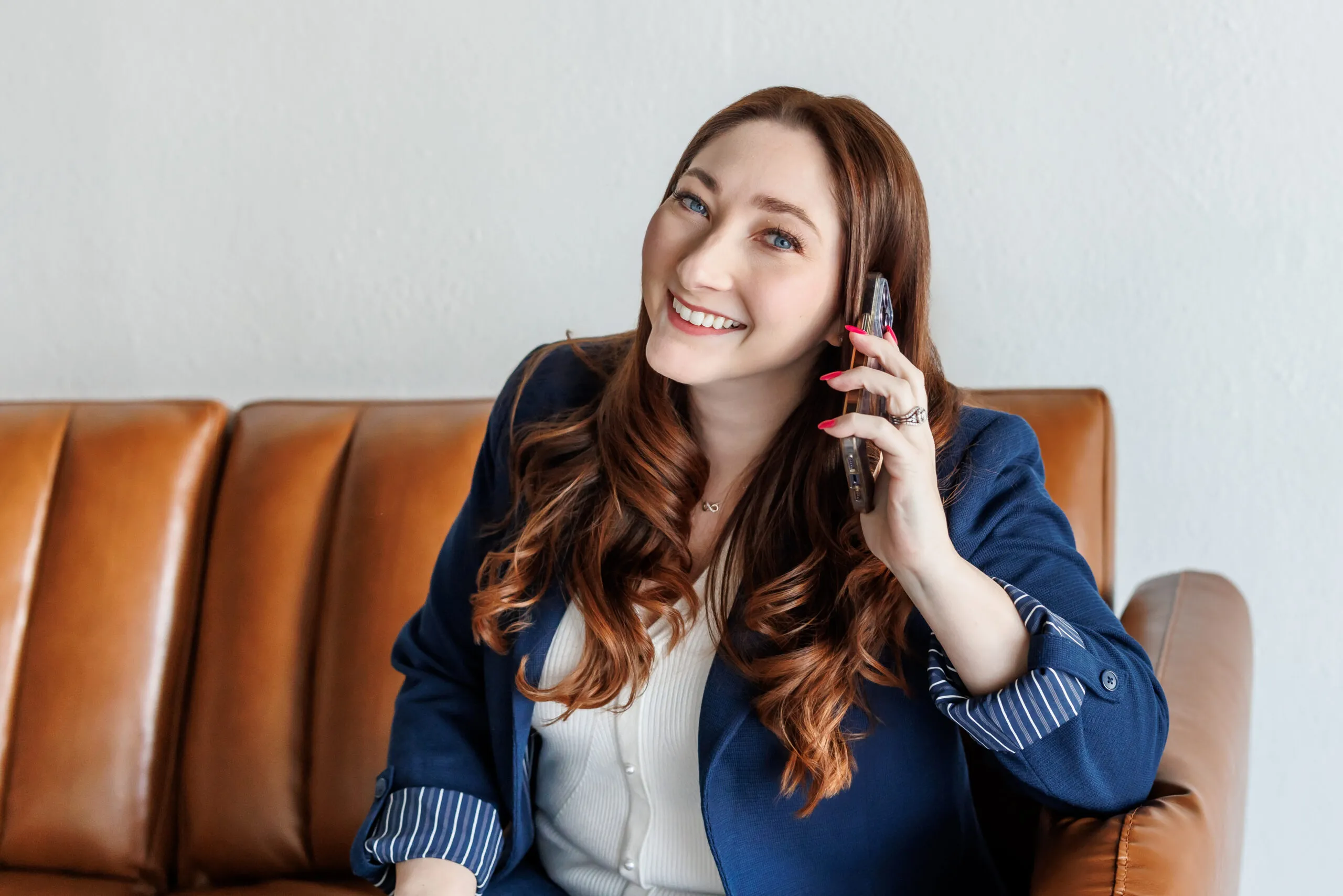 Brand Photography of woman in blue blazer on the phone by Ann Keen Photography in Roseville, CA. why your business feels invisible online