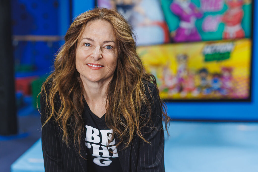 Headshot/Brand photography image of woman owner in black Be the G shirt by Ann Keen Photography in Auburn, CA at Auburn Gymnastics Center